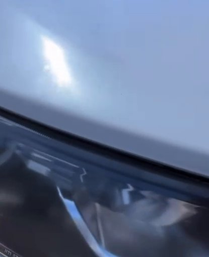 Clear, restored Honda headlight after sun-haze removal and clear coat in Oceanside